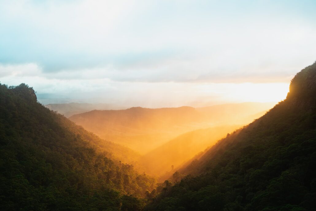 Mountain with sun shining through