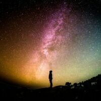 Silhouette on colourful galaxy