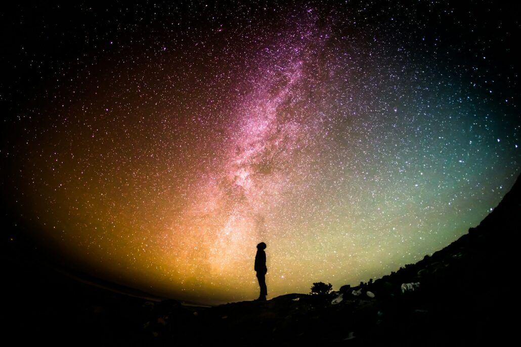 Silhouette on colourful galaxy