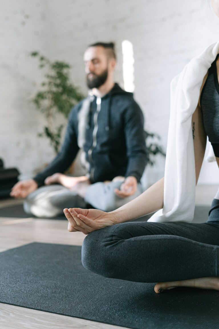 Two people sitting and meditating